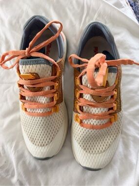 OluKai women’s Cream and Peach Lace-Up Sneakers